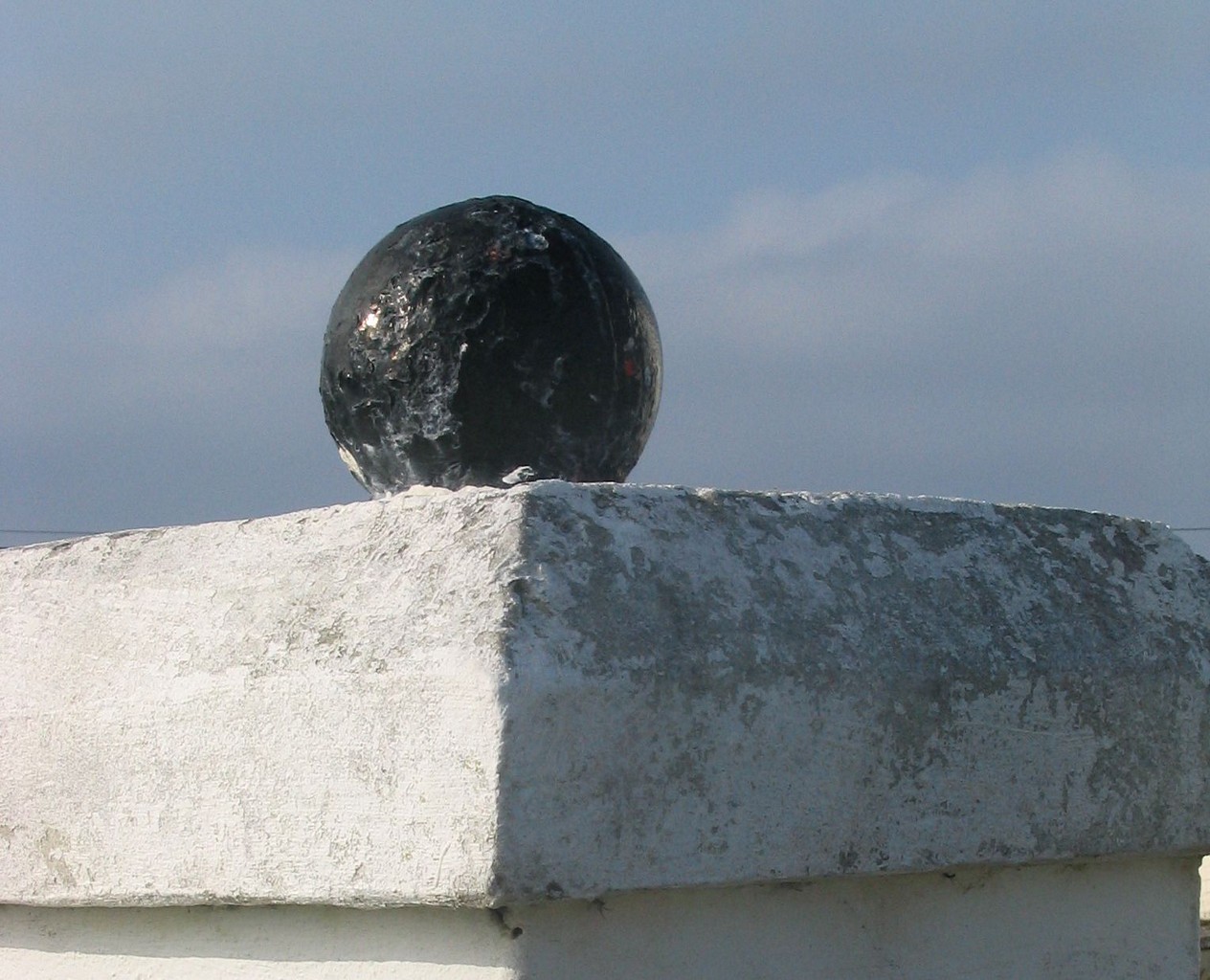 Old glass net floats are a popular pillar ornament.